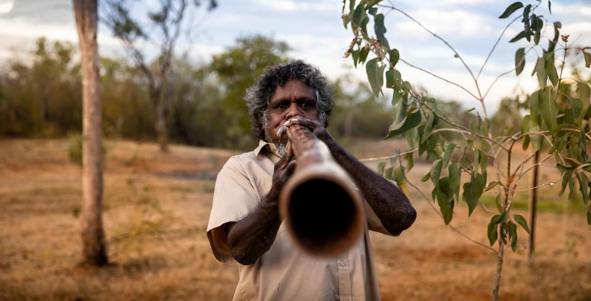 Playing the Didgeridoo at Top Didj Cultural Experience and Art Gallery - Tourism NT/Geoffrey Reid