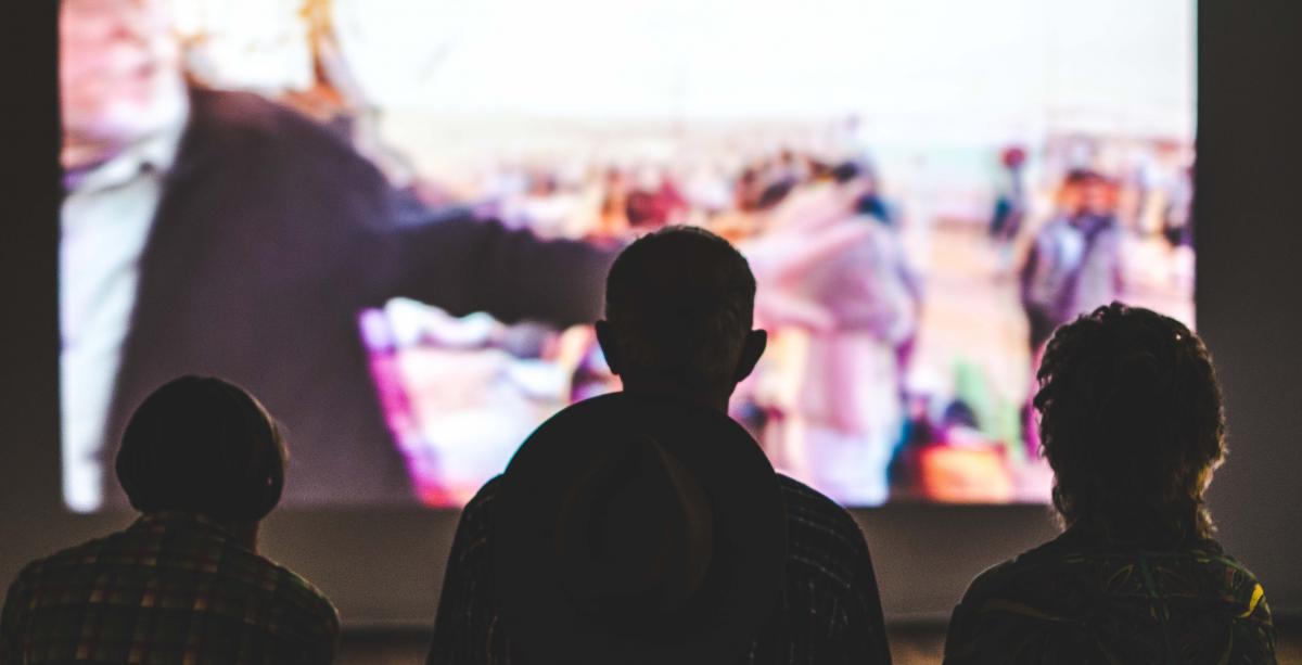 People are watching movie at the cinema