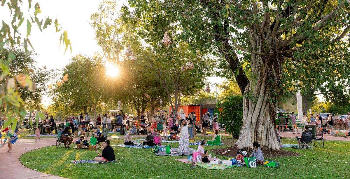 People sitting in Hot Springs Top Park at the Springs Alight event